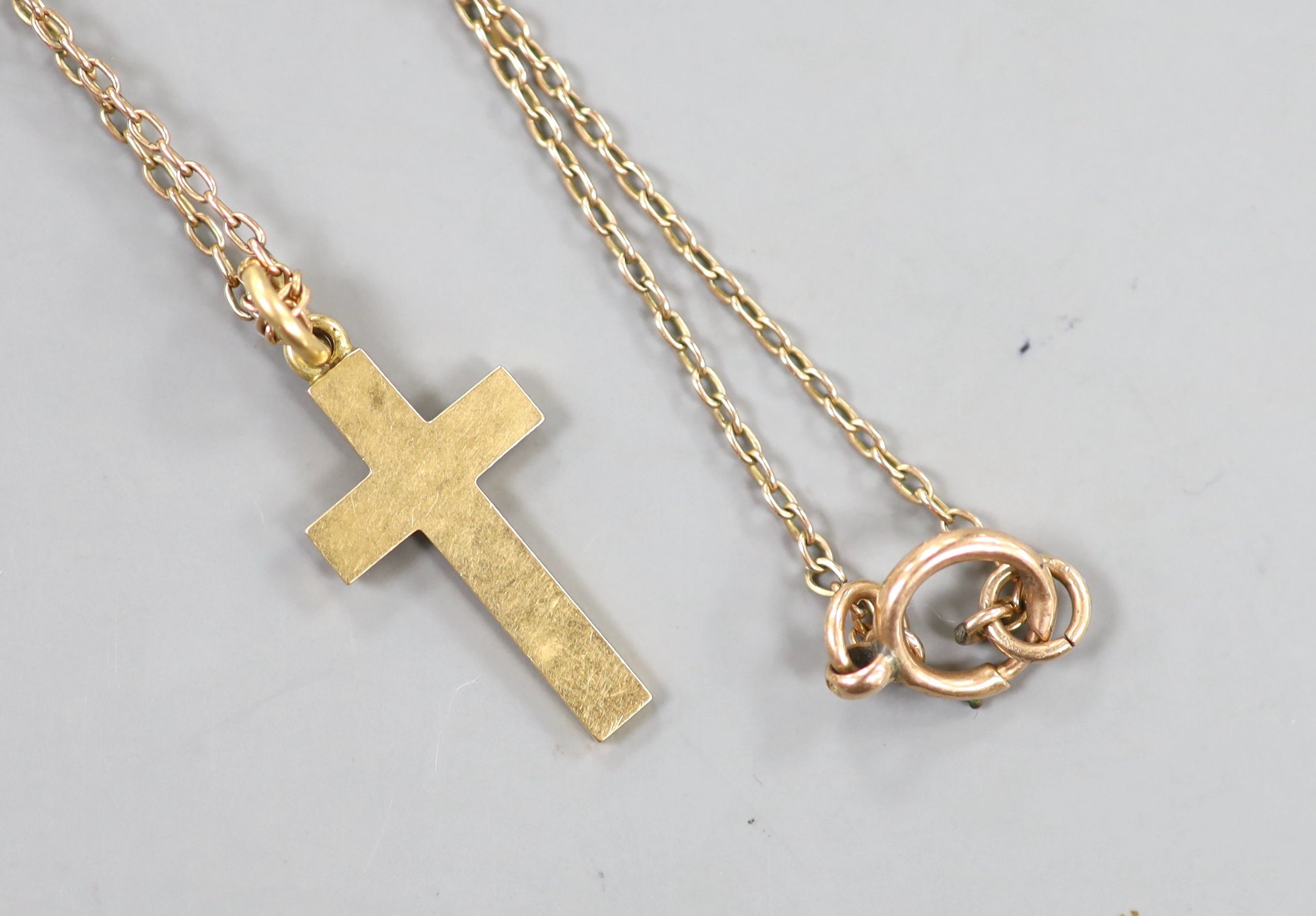 An Edwardian yellow meta cross pendant with engraved inscription, 29mm, on a yellow metal (stamped 9) and seed pearl chain, 72cm, gross weight 88 grams.